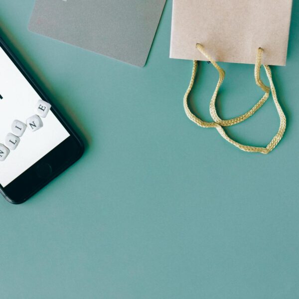 gold chain necklace on white table